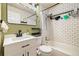 Updated bathroom with sleek vanity, subway tile shower, and modern fixtures at 11376 Forest Dr, Thornton, CO 80233
