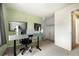 Bedroom featuring a dedicated workspace with dual monitors and closet at 11376 Forest Dr, Thornton, CO 80233