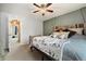 Comfortable primary bedroom with a ceiling fan, TV, and spacious closet at 11376 Forest Dr, Thornton, CO 80233