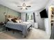 Comfortable primary bedroom with a ceiling fan, TV, and spacious closet at 11376 Forest Dr, Thornton, CO 80233