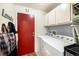 Convenient laundry room with a large capacity washer and dryer, and lots of storage at 11376 Forest Dr, Thornton, CO 80233