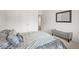 Bedroom featuring neutral colors, carpet flooring, a storage bench, and natural lighting at 562 Twilight Ct, Fort Lupton, CO 80621