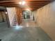 Unfinished basement with concrete floor and stairs at 5922 S Otis Ct, Littleton, CO 80123