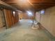 Unfinished basement area with partial carpet and window at 5922 S Otis Ct, Littleton, CO 80123