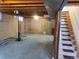 Unfinished basement with concrete floor and open ceiling, offering potential for customization and additional living space at 5922 S Otis Ct, Littleton, CO 80123