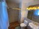 Bathroom with shower, toilet and pedestal sink at 5922 S Otis Ct, Littleton, CO 80123