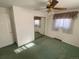 Bedroom with mirrored closet doors and carpet flooring at 5922 S Otis Ct, Littleton, CO 80123