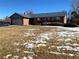 Ranch style brick home with attached garage and landscaped yard at 5922 S Otis Ct, Littleton, CO 80123