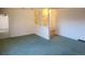 Bright living room featuring decorative wall elements and carpeted flooring at 5922 S Otis Ct, Littleton, CO 80123