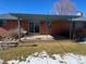 Covered patio with concrete flooring and small bird bath at 5922 S Otis Ct, Littleton, CO 80123