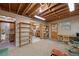 Finished basement space, perfect for a home office or gym with wooden shelving and carpet flooring at 34480 Pine Ridge Cir, Elizabeth, CO 80107