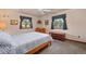 Cozy bedroom with carpet flooring, two windows, ceiling fan, and wood furniture at 34480 Pine Ridge Cir, Elizabeth, CO 80107