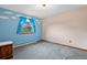 Bedroom featuring blue walls, carpet flooring, a window with a view, and natural lighting at 34480 Pine Ridge Cir, Elizabeth, CO 80107