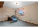 Neutral Bedroom with a blue chair and side table with pink curtains at 34480 Pine Ridge Cir, Elizabeth, CO 80107