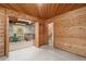 View of the recreation and office area from the hallway showing stairs, weights, dartboard, and seating at 34480 Pine Ridge Cir, Elizabeth, CO 80107