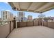 Balcony overlooking a neighborhood featuring mid-rise buildings and a blue sky at 700 N Washington St, Denver, CO 80203