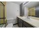 This bathroom features a single sink vanity, tub and toilet at 700 N Washington St, Denver, CO 80203