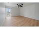 Spacious bedroom with light wood flooring and natural light from a large window at 700 N Washington St, Denver, CO 80203