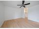 Bedroom with light wood flooring and ceiling fan adjacent to a large closet at 700 N Washington St, Denver, CO 80203