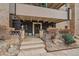 Elegant entrance with stone accents, lush landscaping, and prominent building number creates a welcoming facade at 700 N Washington St, Denver, CO 80203