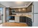 Efficient kitchen layout with sleek cabinets, white appliances, and ample countertop space for meal preparation at 700 N Washington St, Denver, CO 80203