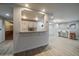 Pass-through kitchen and breakfast bar with contemporary finishes at 700 N Washington St, Denver, CO 80203