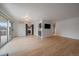 Bright living room offers hardwood flooring and sliding glass doors to balcony at 700 N Washington St, Denver, CO 80203