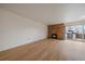 Spacious living room with hardwood floors featuring a cozy fireplace, offering both style and comfort at 700 N Washington St, Denver, CO 80203