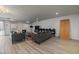 Comfortable lounge area with modern sofas, fireplace, and hardwood floors at 700 N Washington St, Denver, CO 80203