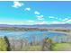 Beautiful aerial view of a lake and city on a sunny day with fluffy white clouds at 8312 S Peninsula Dr, Littleton, CO 80120