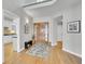 Inviting foyer with hardwood floors and direct access to the kitchen at 8312 S Peninsula Dr, Littleton, CO 80120