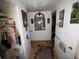 Hallway with coat rack, mirrors, and wood flooring at 1302 S Parker Rd # 225, Denver, CO 80231