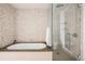 Spa-like bathroom with a soaking tub and walk-in shower at 1133 14Th St # 2720, Denver, CO 80202