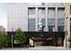 Modern building exterior with a porte cochere and landscaping at 1133 14Th St # 2720, Denver, CO 80202