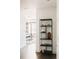 Hallway with modern shelving and a view into a bedroom at 1133 14Th St # 2720, Denver, CO 80202