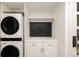 Laundry room with a stackable washer and dryer, and additional storage at 1133 14Th St # 2720, Denver, CO 80202