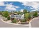 Aerial view of the home on a corner lot with well-manicured landscaping and mature trees at 1200 Butterfield Ln, Castle Rock, CO 80104