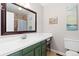 This bathroom features a vanity sink, toilet, a large mirror, and a shower behind a curtain at 1200 Butterfield Ln, Castle Rock, CO 80104