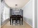 Formal dining room featuring a stylish light fixture, gray walls and a picturesque landscape painting at 1200 Butterfield Ln, Castle Rock, CO 80104