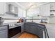 Well-appointed kitchen with modern appliances, granite countertops, and white cabinetry at 1200 Butterfield Ln, Castle Rock, CO 80104