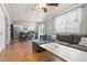 Open-concept layout with a modern kitchen flowing into a comfortable living area and hardwood floors at 1200 Butterfield Ln, Castle Rock, CO 80104