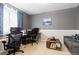 This office features two desks, two chairs, a couch, gray walls, and decor on the walls at 1200 Butterfield Ln, Castle Rock, CO 80104