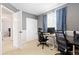 This office features gray walls, a desk, a chair, a closet, and a window with curtains at 1200 Butterfield Ln, Castle Rock, CO 80104