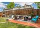 Outdoor patio with fire pit, seating area, and view of fenced yard and home at 1200 Butterfield Ln, Castle Rock, CO 80104