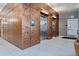 Hallway with elevators and decorative walls, and tiled flooring at 603 Inca St # 330, Denver, CO 80204