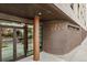 Building entrance with 'La Tela' sign, brown brick facade, and double glass doors at 603 Inca St # 330, Denver, CO 80204