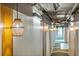 Hallway with modern lighting fixtures, white walls with stripes, and carpeted flooring at 603 Inca St # 330, Denver, CO 80204