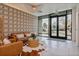 Inviting lobby featuring modern patterned wallpaper, stylish furniture, a decorative cowhide rug, and tiled flooring at 603 Inca St # 330, Denver, CO 80204