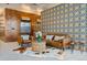 Elegant lobby showcasing patterned wallpaper, contemporary furniture, a decorative rug, and tiled flooring at 603 Inca St # 330, Denver, CO 80204