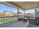 Relax on your back deck offering great views of your well-kept yard and cozy lounge furniture at 6172 N Liverpool St, Aurora, CO 80019